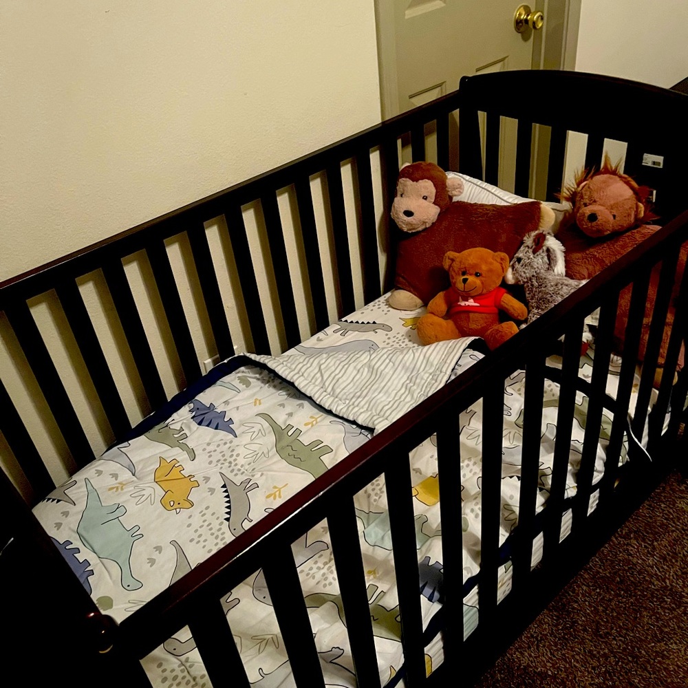 Baby Crib 4 in 1 new with mattress still has plastic on it